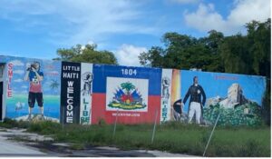 Historic mural welcoming visitors to Little Haiti (Miami, Florida). The mural includes Haiti’s flag and the Citadelle Laferrière, which is a famous structure in Haiti that symbolizes Haiti’s independence and strength. 
