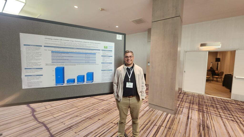 Javier Pineda standing in front of the approved abstract regarding Faculty Promotion Javier Pineda is a co-author of the approved abstract: "Climbing the Ladder Without Seeing the Rungs: Promotions Criteria for Medical Educators" at the 2023 COMSEP Annual Conference.